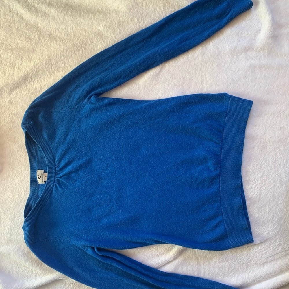 sweater with a few subtle details on next and shoulders